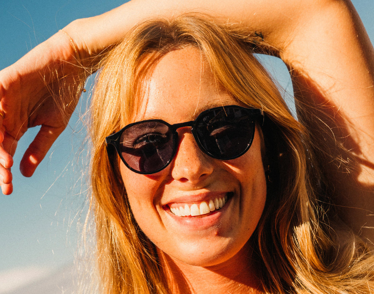STORY girl smiling wearing sunski vallarta sunglasses