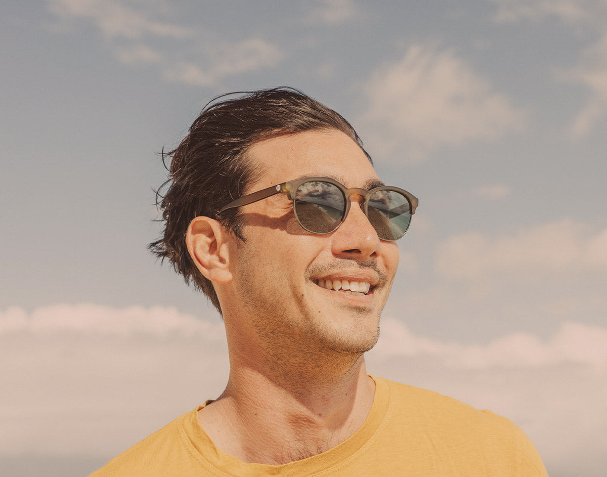 STORY guy in the wind wearing sunski avila sunglasses
