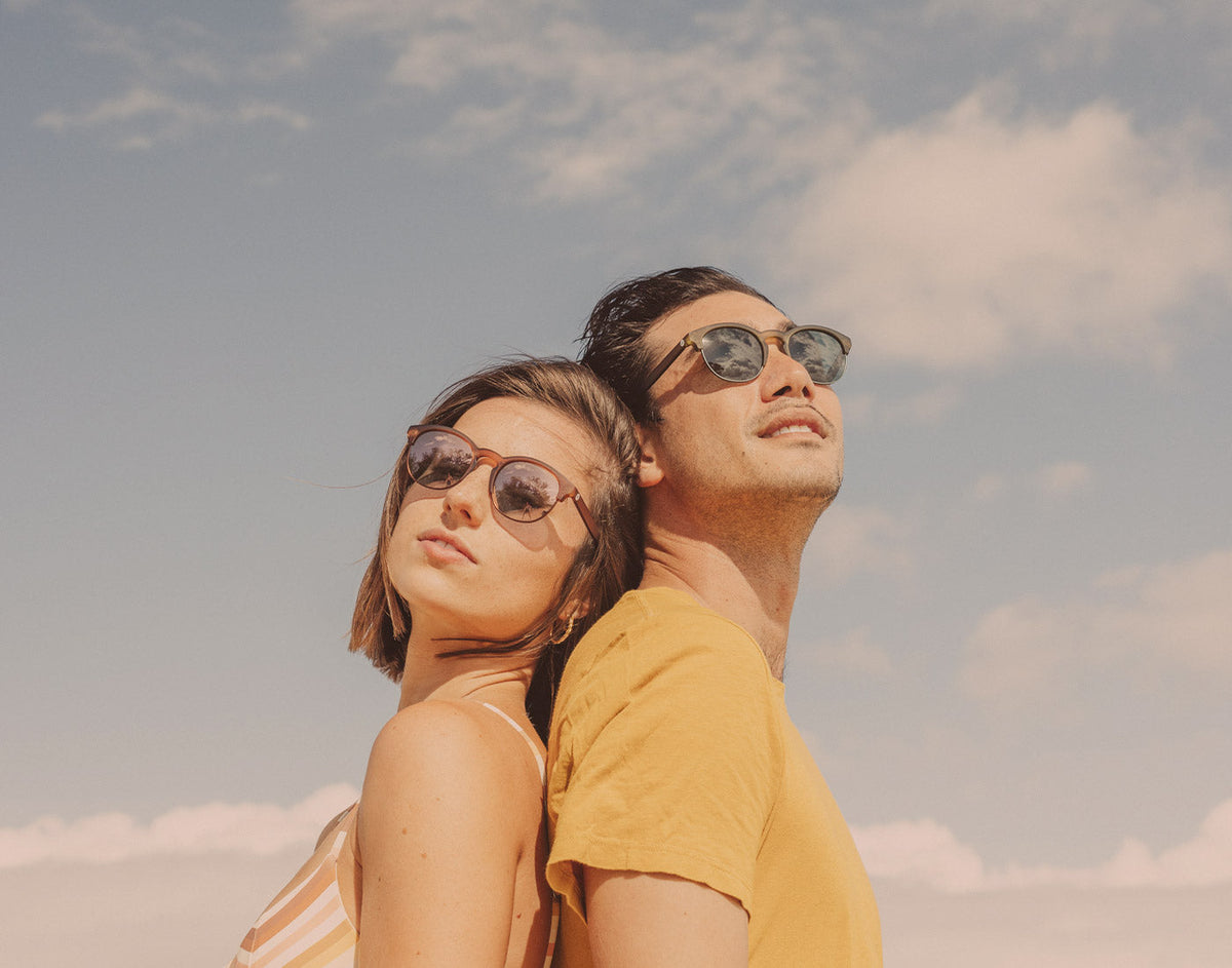 STORY guy and girl wearing sunski avila sunglasses