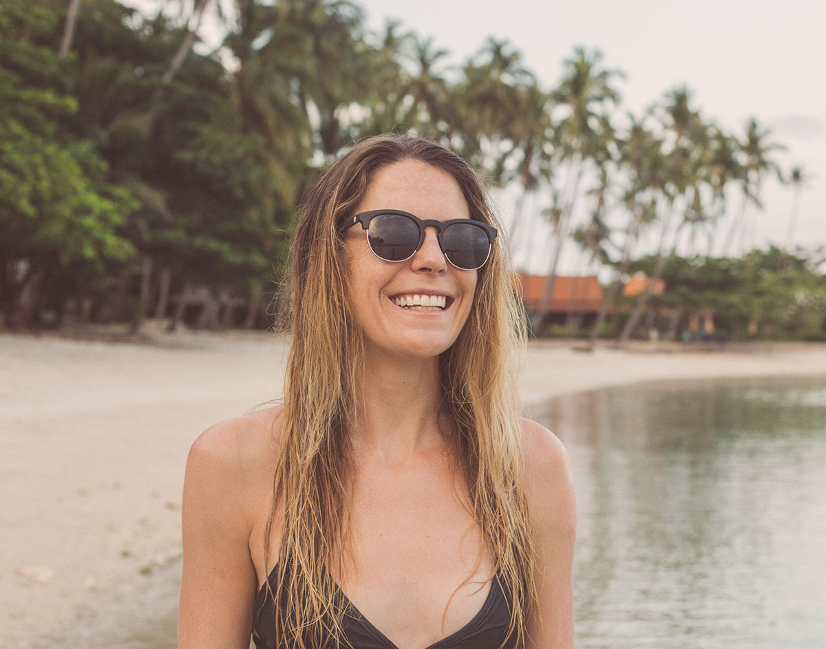 STORY girl smiling wearing sunski avila sunglasses