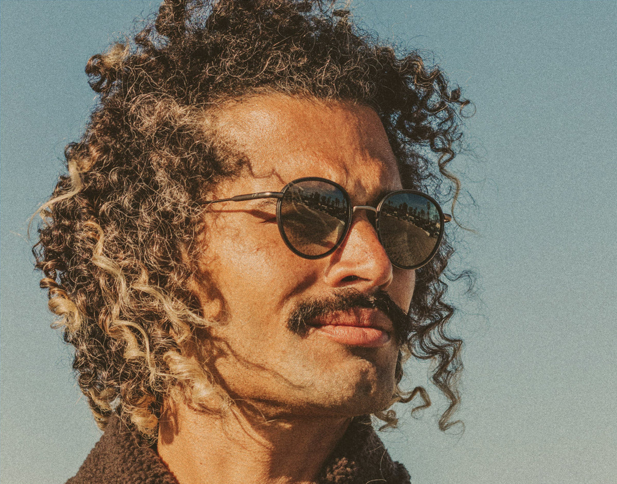 STORY profile of man wearing sunski baia sunglasses