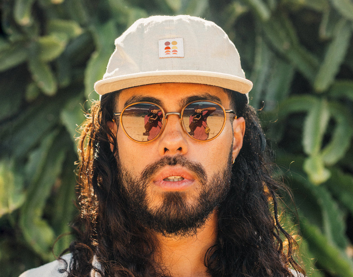 STORY man looking directly at camera wearing sunski baia sunglasses