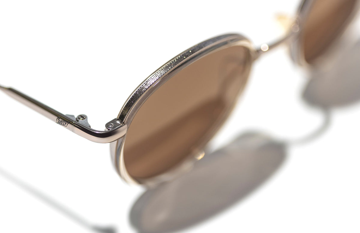 PROD_SUN_BA_CAM sunski baia champagne amber close up of top of frame