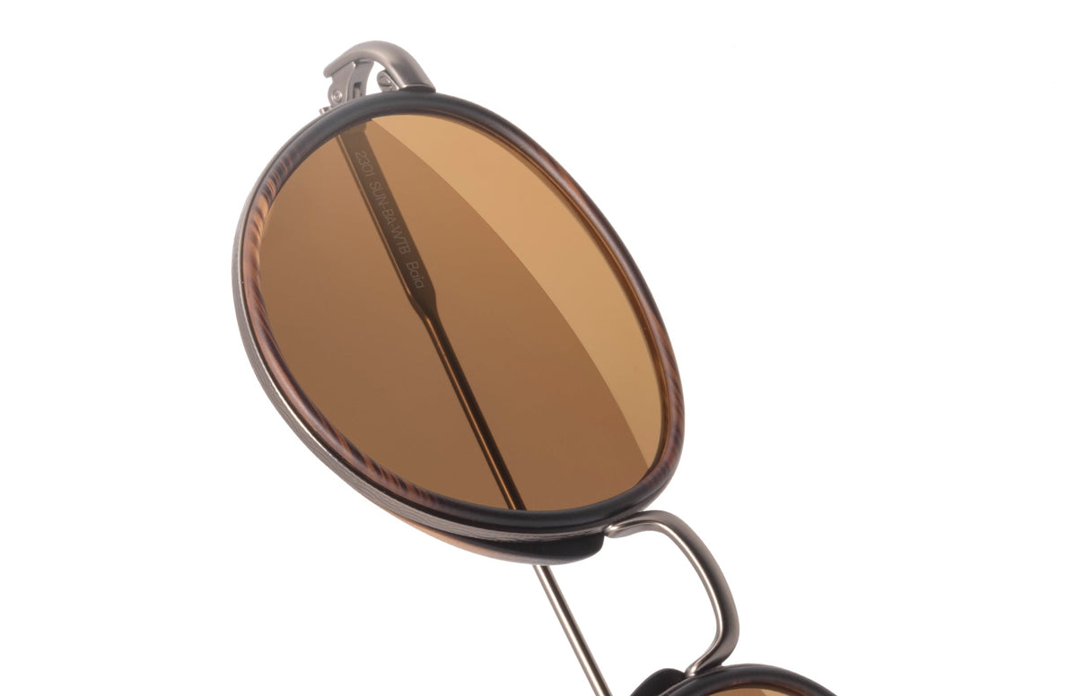 PROD_SUN_BA_WTB  sunski baia tortoise bronze close up of lens