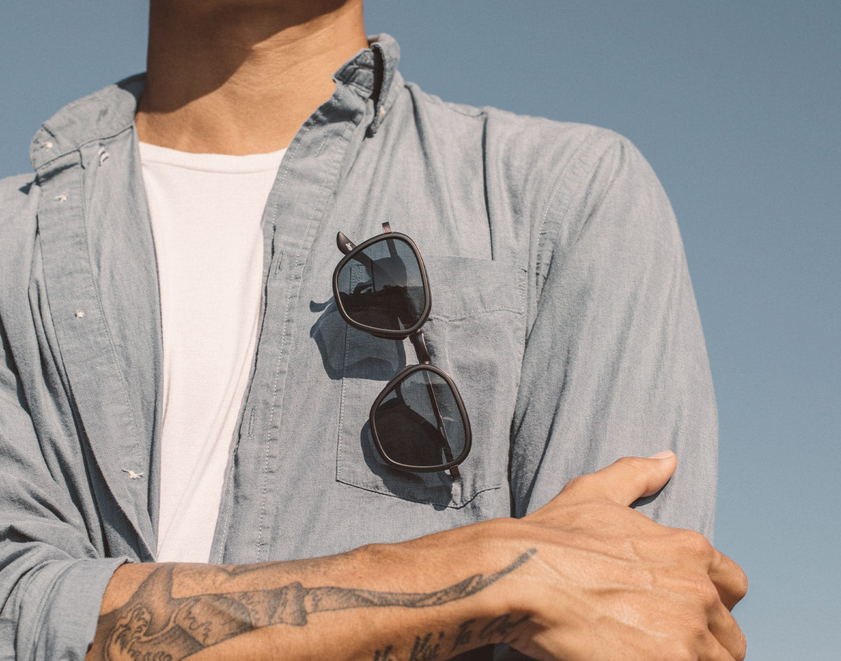 STORY sunski bernina sunglasses hanging on a shirt pocket
