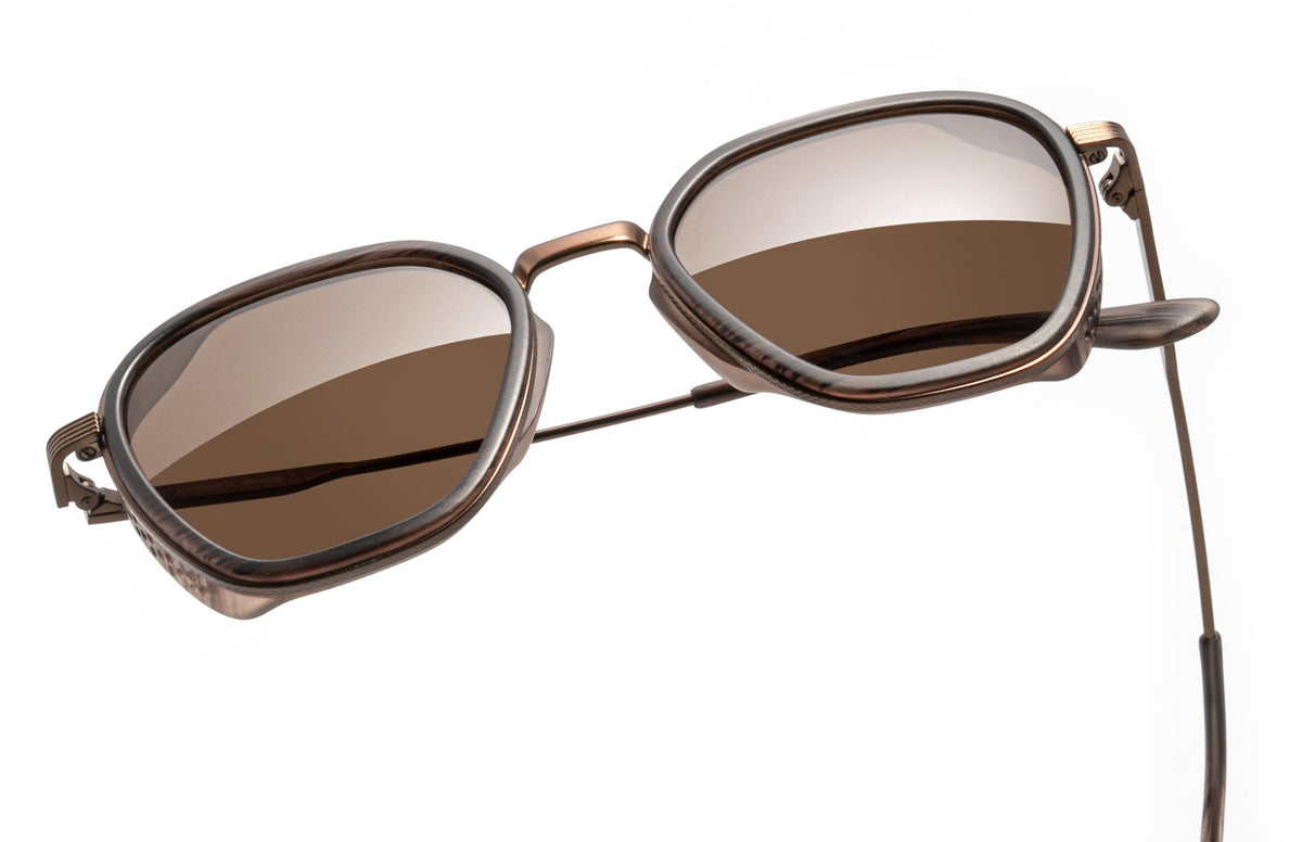 PROD_SUN_BE_WTA sunski bernina wire tortoise amber close up with one arm folded