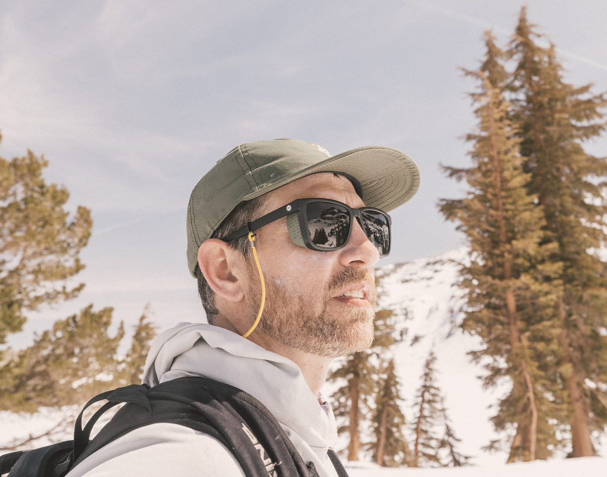 STORY profile of guy in the snowy wearing sunski couloir sunglasses