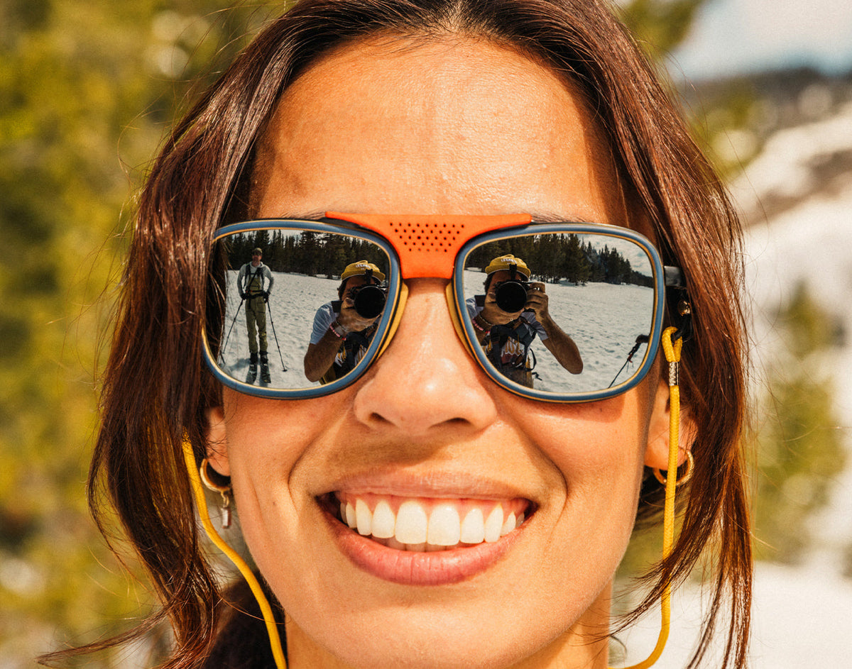 STORY close up of girl smiling wearing sunski ferrata sunglasses