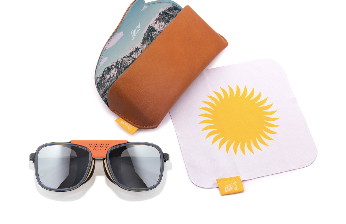 PROD_SUN_FE_SSI sunski ferrata spruce silver laydown with sunglasses and case 