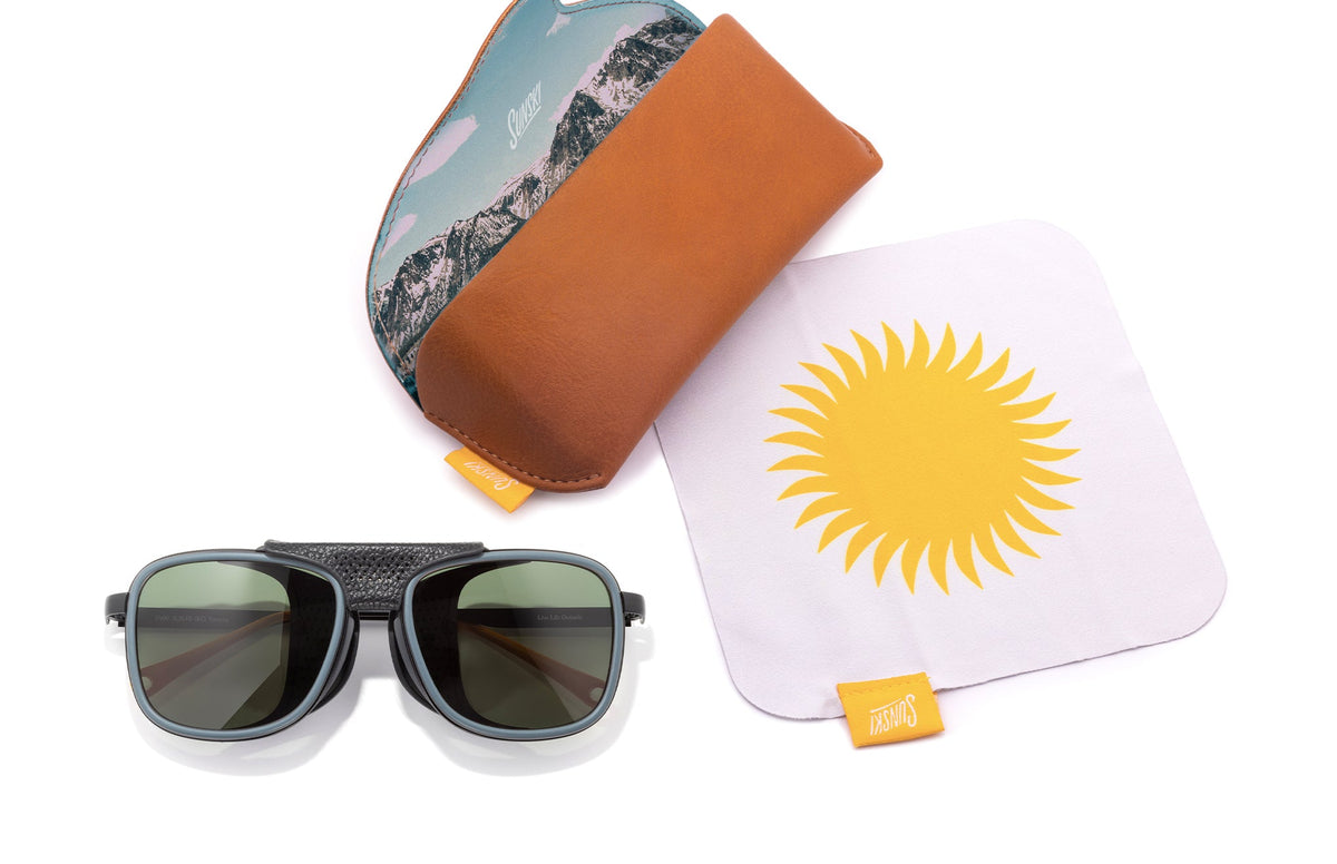 PROD_SUN_FE_SFO sunski ferrata storm forest laydown with sunglasses and case