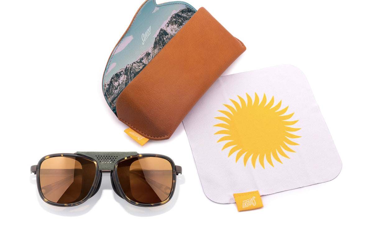 PROD_SUN_FE_TBR sunski ferrata tortoise bronze laydown with sunglasses and case
