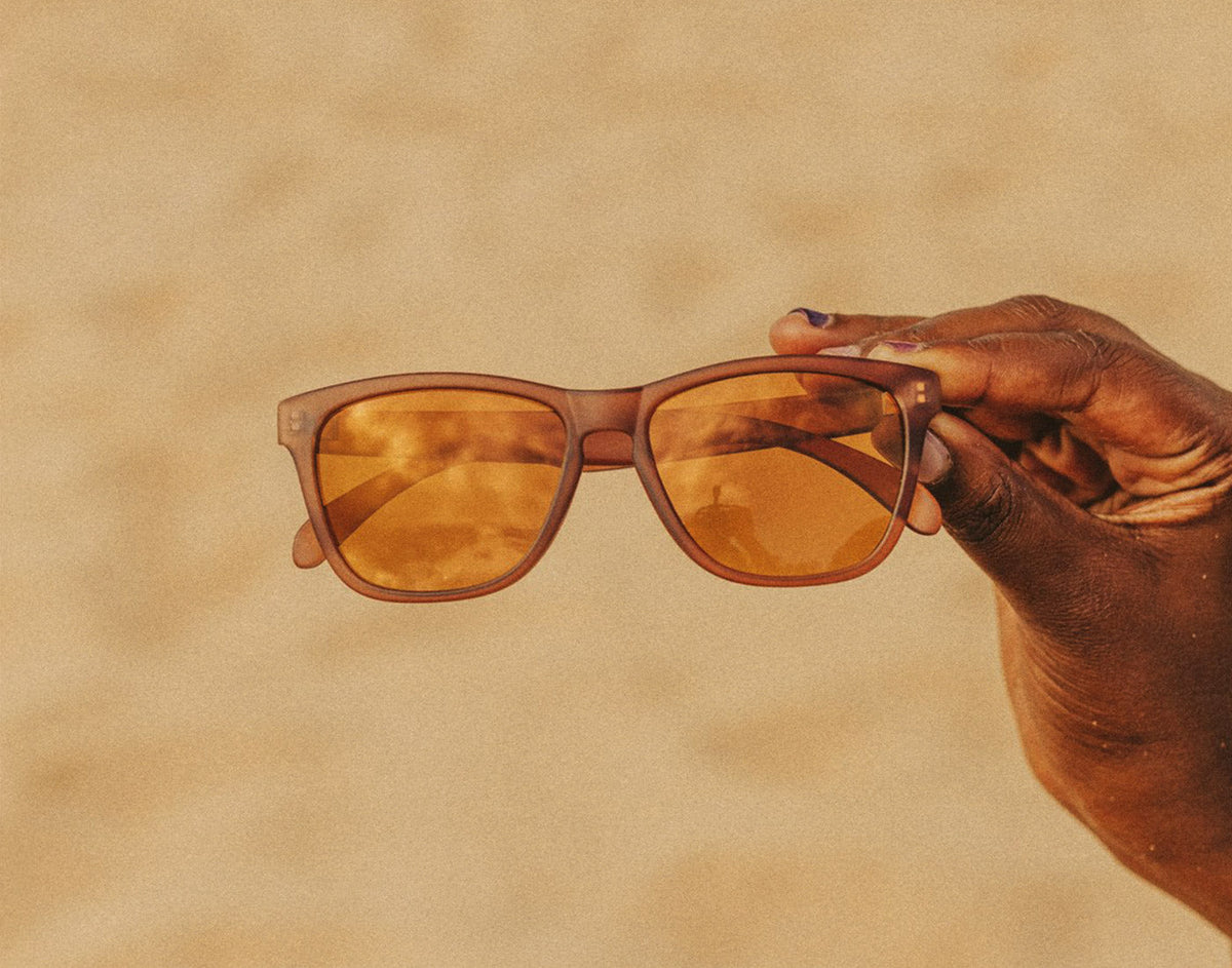 STORY hand holding sunski headland sunglasses