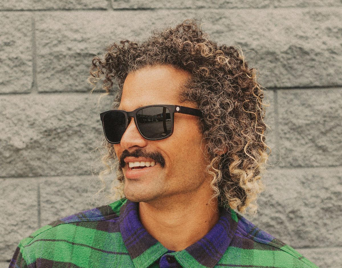 STORY profile of man wearing sunski kiva sunglasses