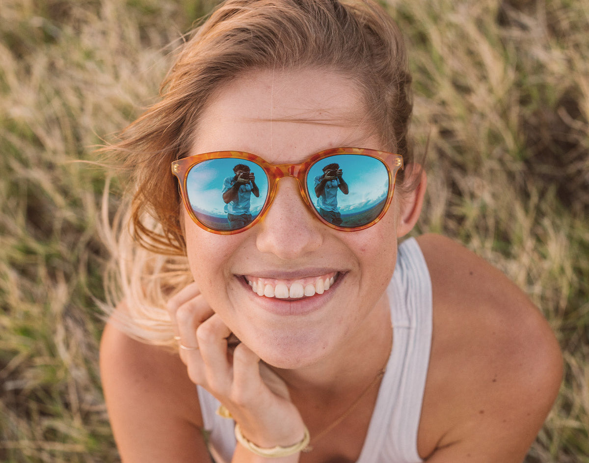 STORY girl smiling wearing sunski makani sunglasses
