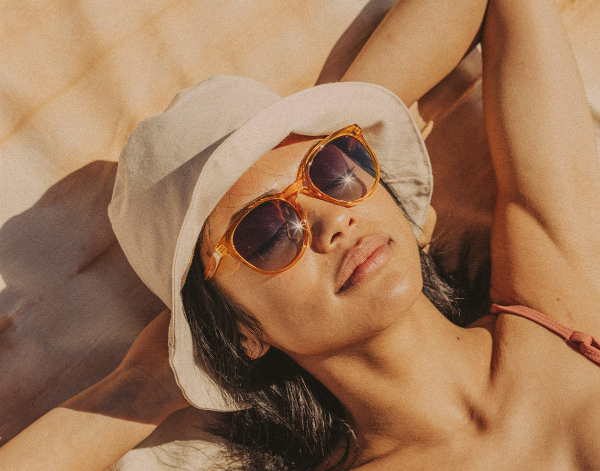STORY woman basking wearing sunski makani sunglasses