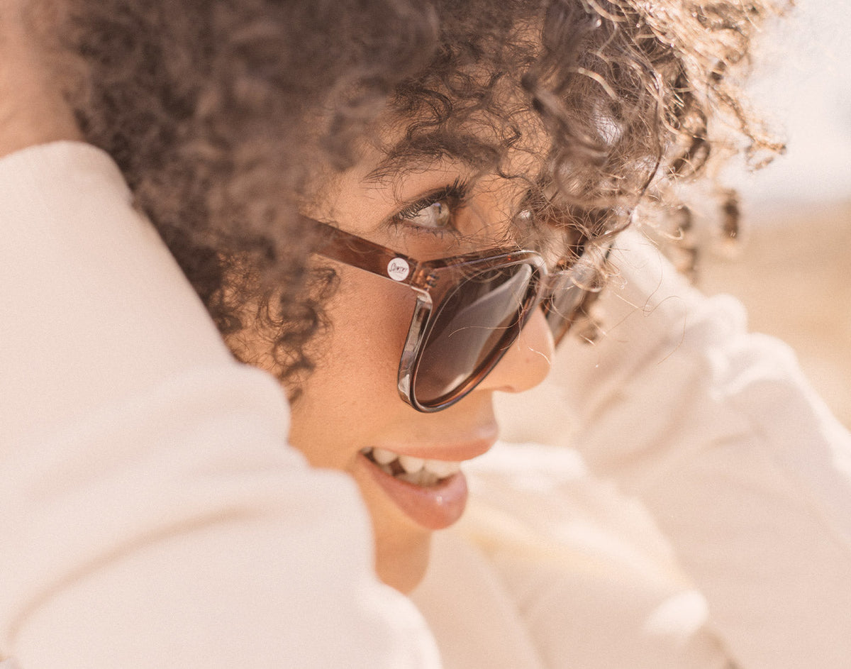 STORY close up profile of girl wearing sunski makani sunglasses