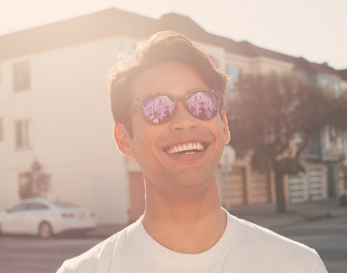 STORY guy smiling wearing sunski makani sunglasses