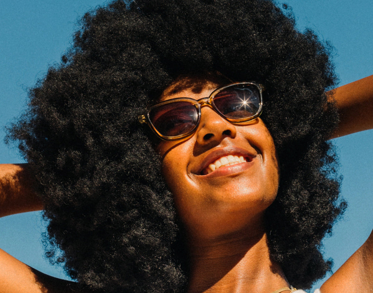 STORY girl basking wearing sunski miho sunglasses