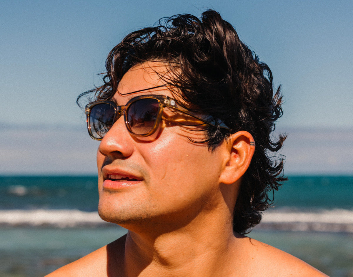 STORY profile of man on beach wearing sunski miho sunglasses