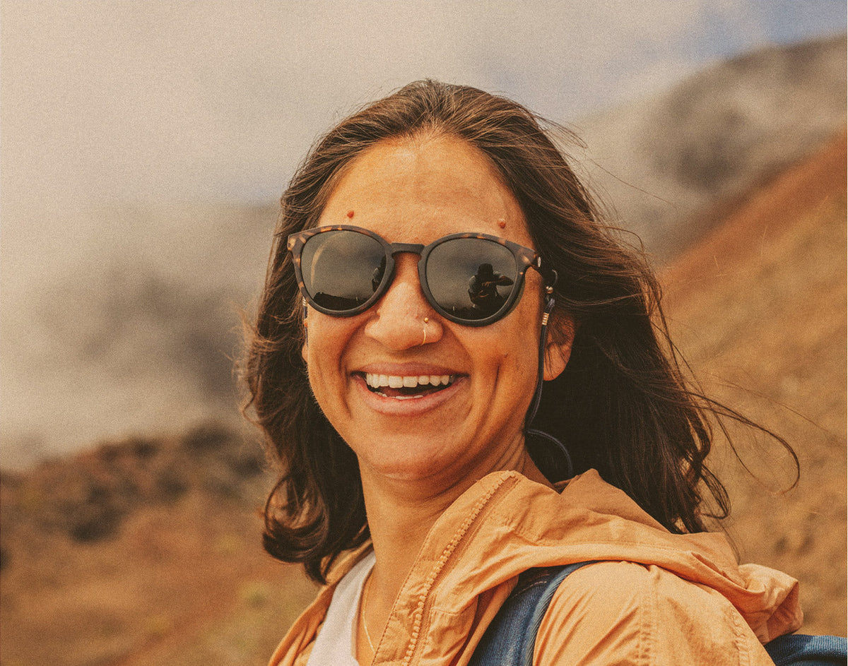 STORY woman laughing wearing sunski tera sunglasses