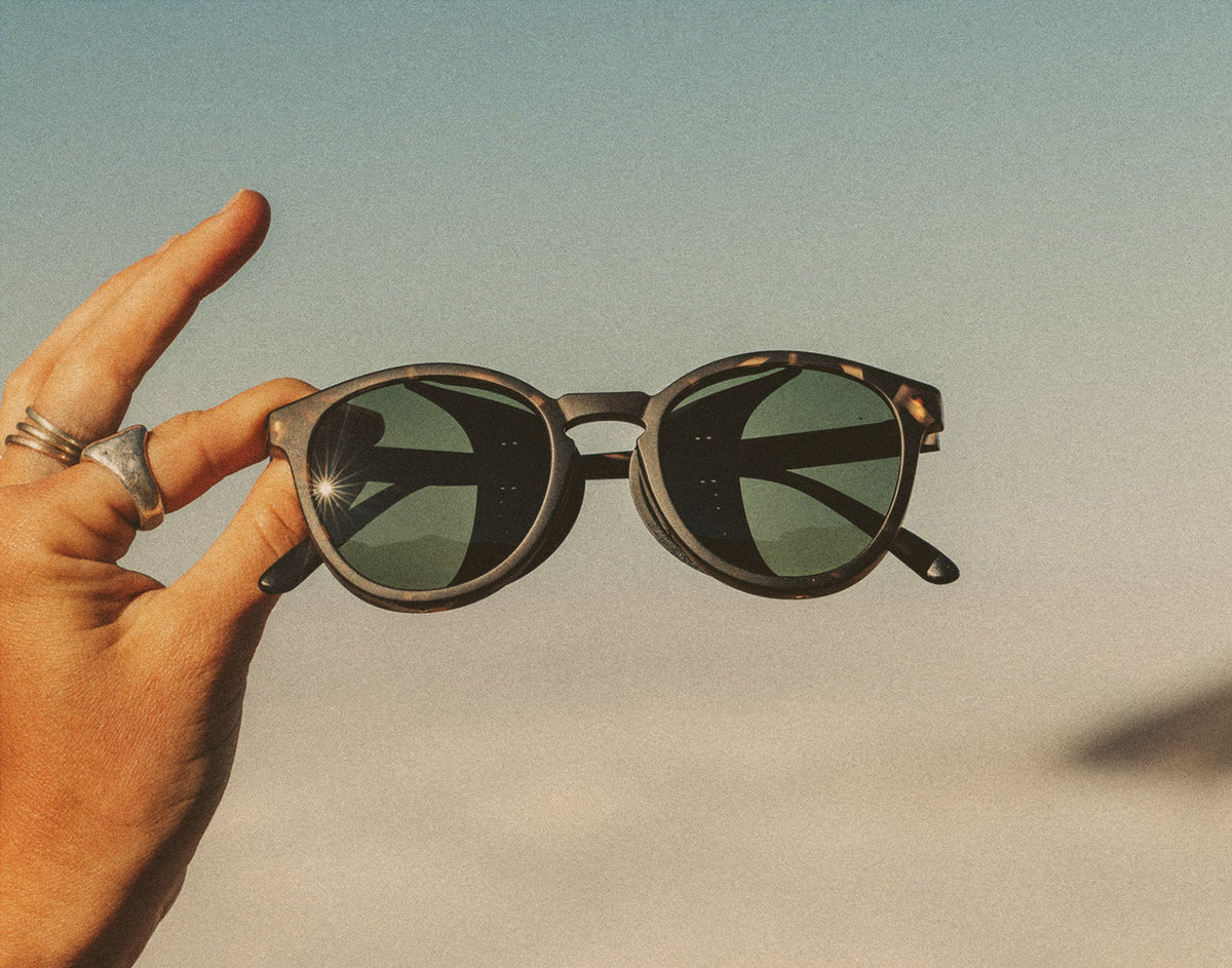 STORY hand holding sunski tera sunglasses 