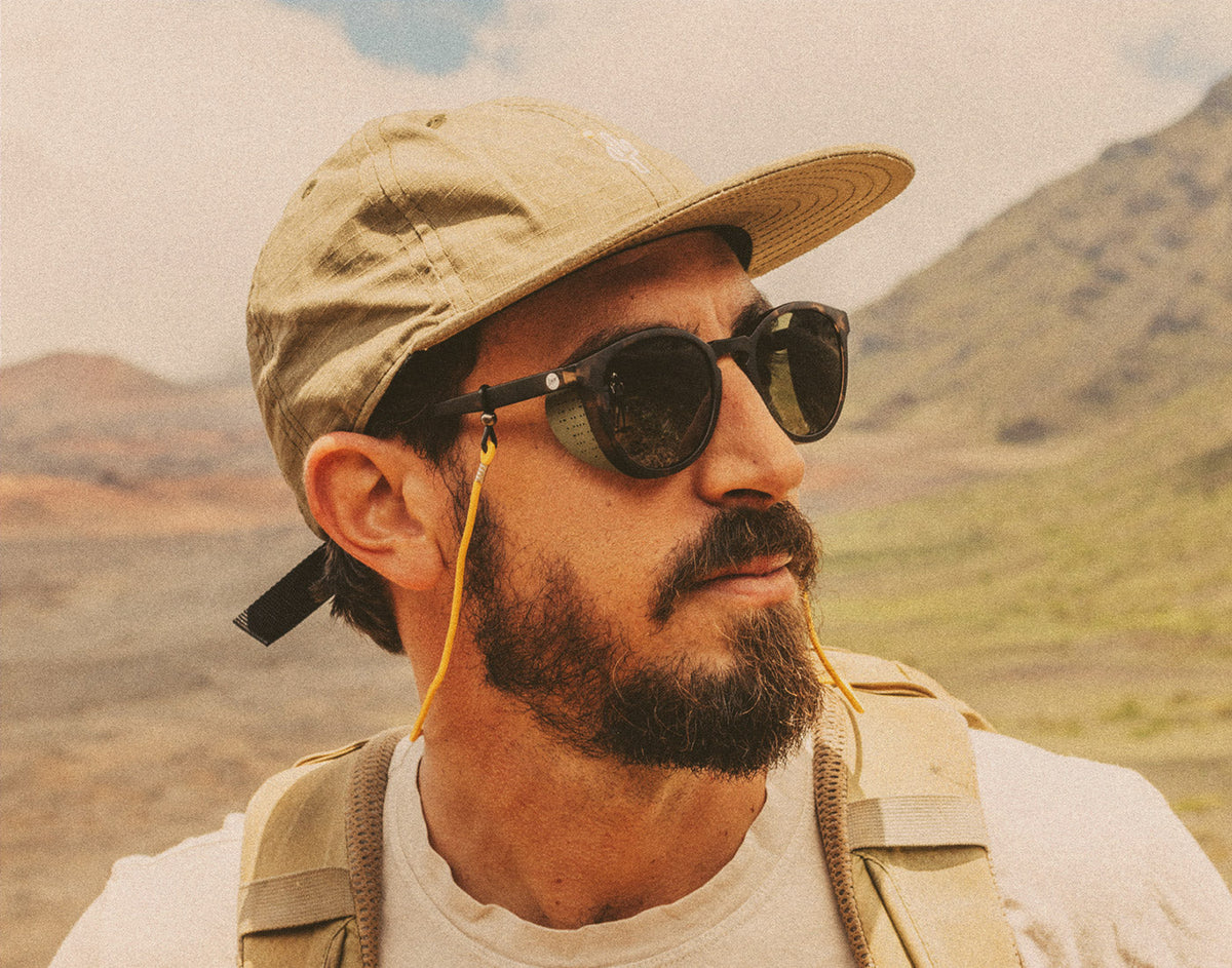 STORY profile of man on a hike wearing sunski tera sunglasses