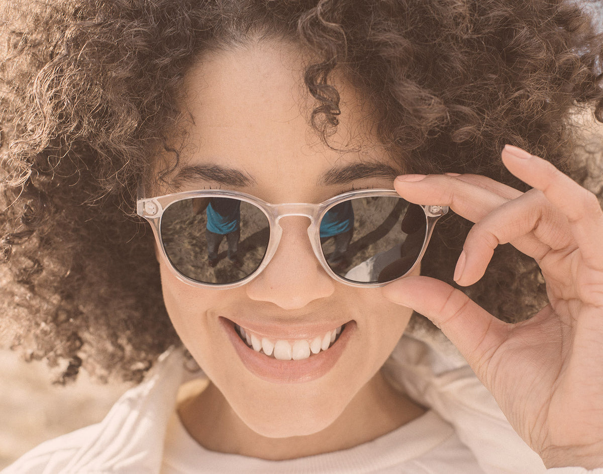STORY girl smiling wearing sunski yuba sunglasses