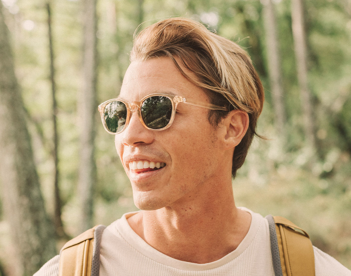 STORY guy hiking wearing sunski yuba sunglasses