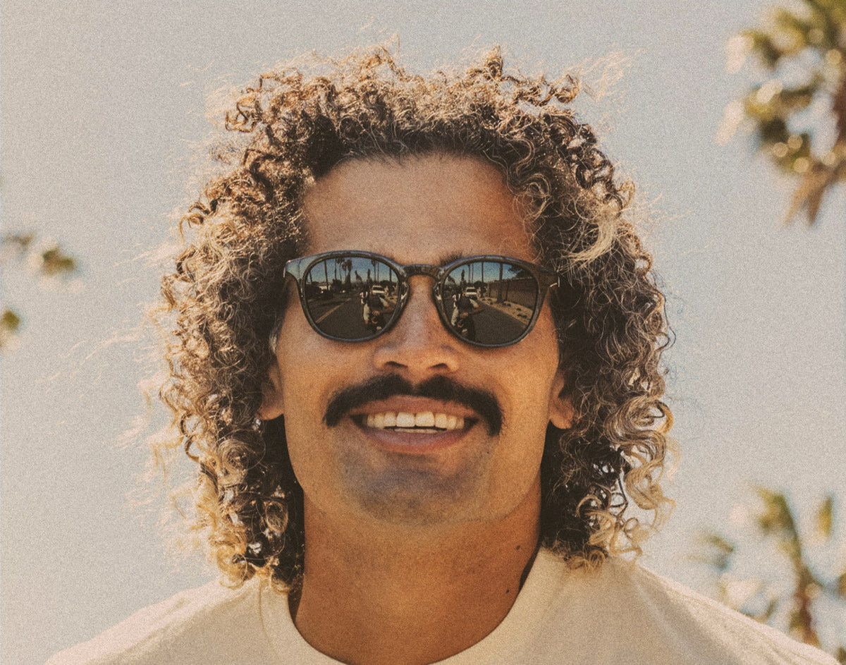 STORY close up of man wearing sunski yuba sunglasses