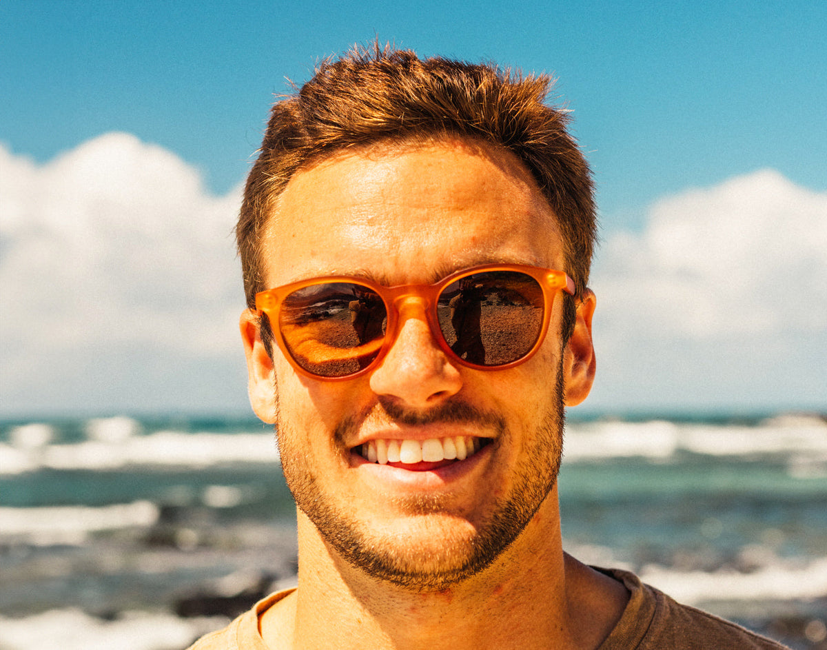 STORY guy smiling wearing sunski yuba sunglasses