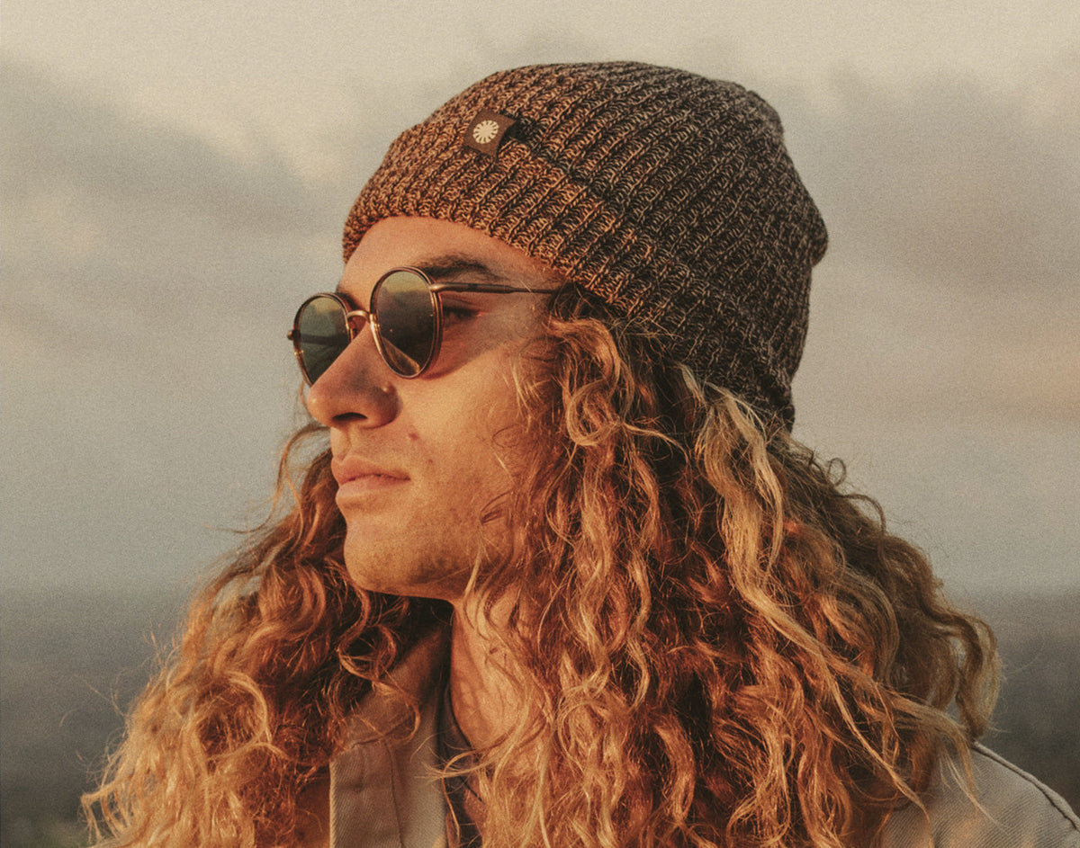 STORY profile of guy wearing sunski shoulder season beanie