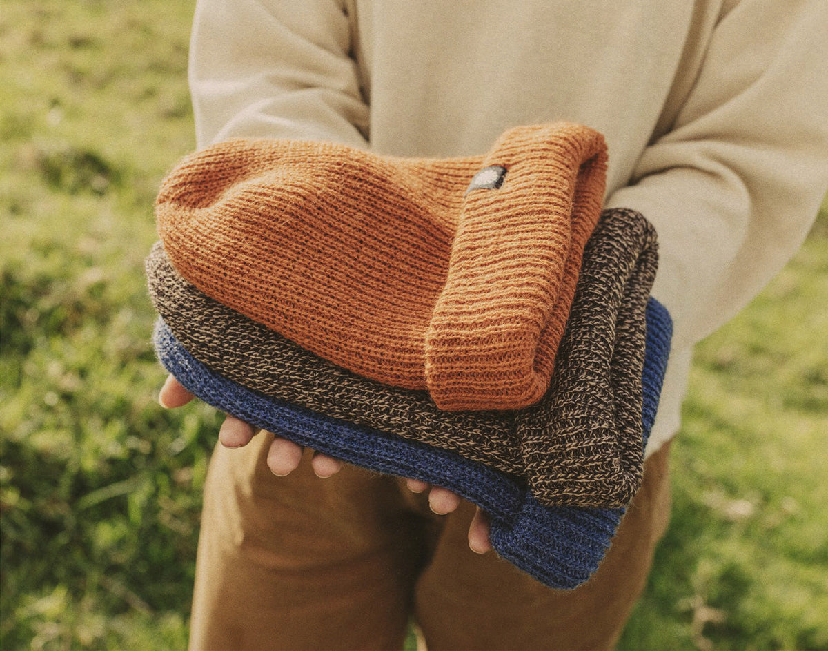 STORY hands holding all three sunski shoulder season beanies