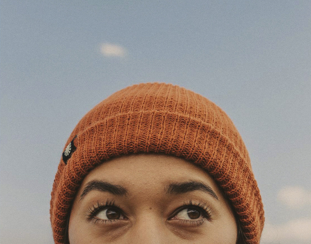 STORY close up of persons eyes wearing sunski shoulder season beanie