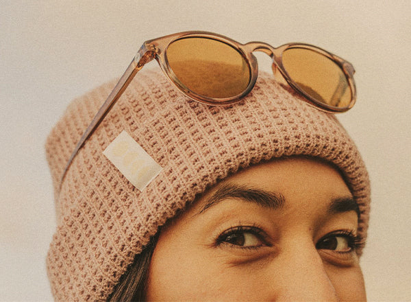 RICH close up of girl wearing sunski winter sun beanie