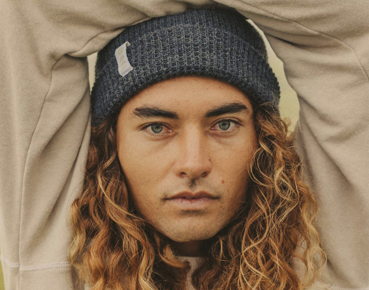 STORY close up of man wearing sunski winter sun beanie