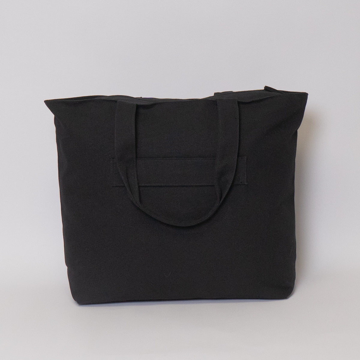 travel tote bag with trolley sleeve#color_ivory-black