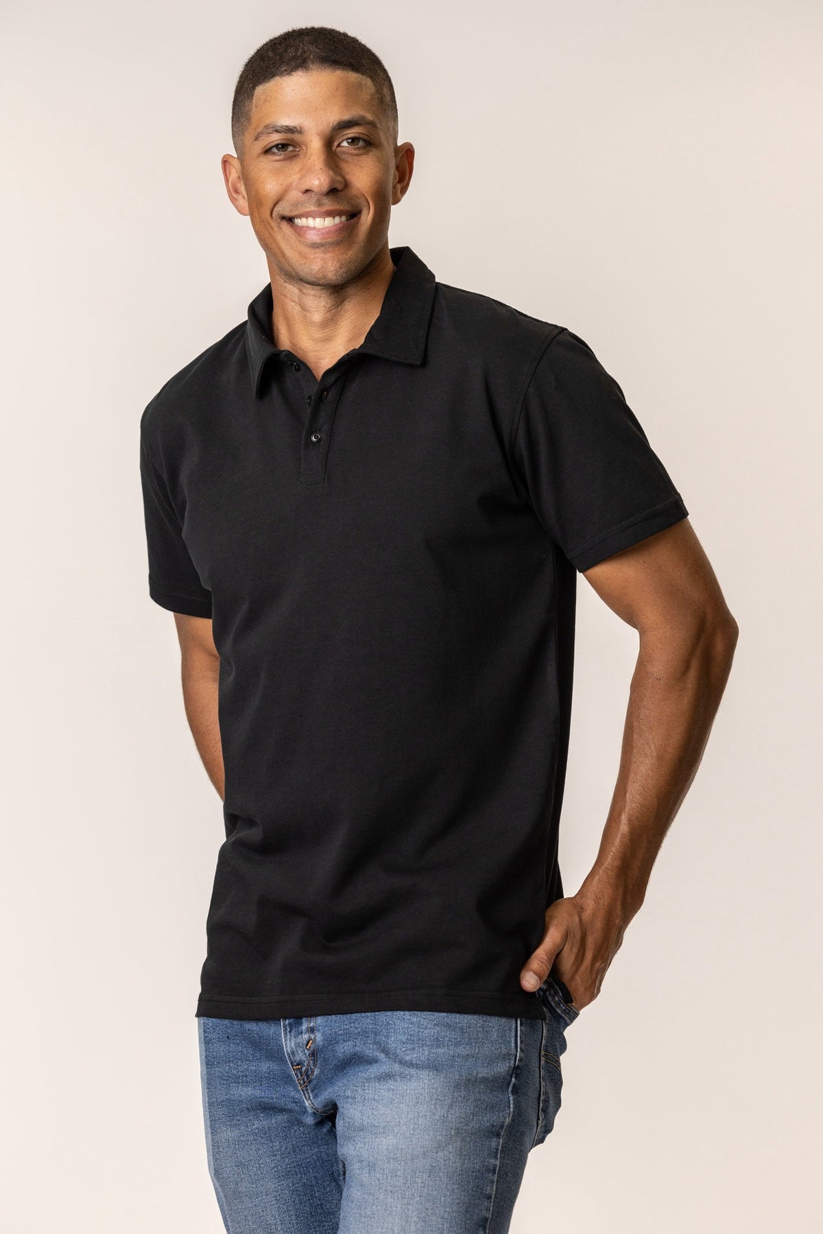 Man wearing a black polo shirt 
