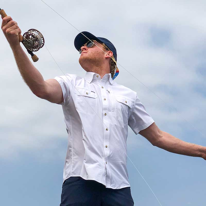 May in white shirt fishing 