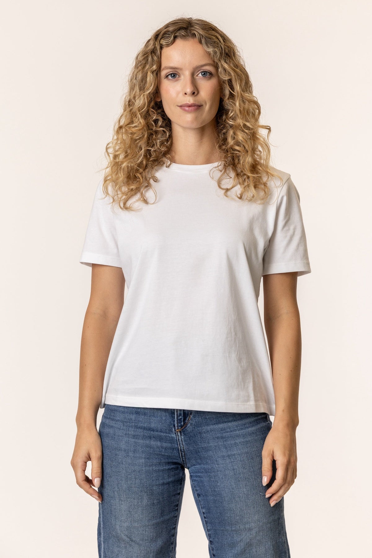 Woman wearing a plain white t-shirt #color_white